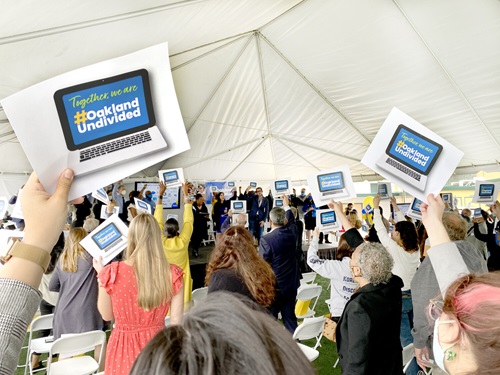 OaklandUndivided rally with tablets in air