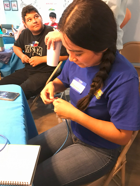 Digital Opportunity Lab young student crimping 