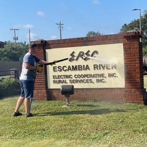 Escambia River Elec Coop Sign Cleaning with hose