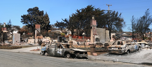 A home and two parked cars are nearly burnt to ash in aftermath of gas pipeline explosion in San Bruno in 2010