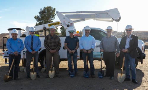 Wecom representatives and Flagstaff city officials stand in front for Wecom truck holding shovels at groundbreaking ceremony