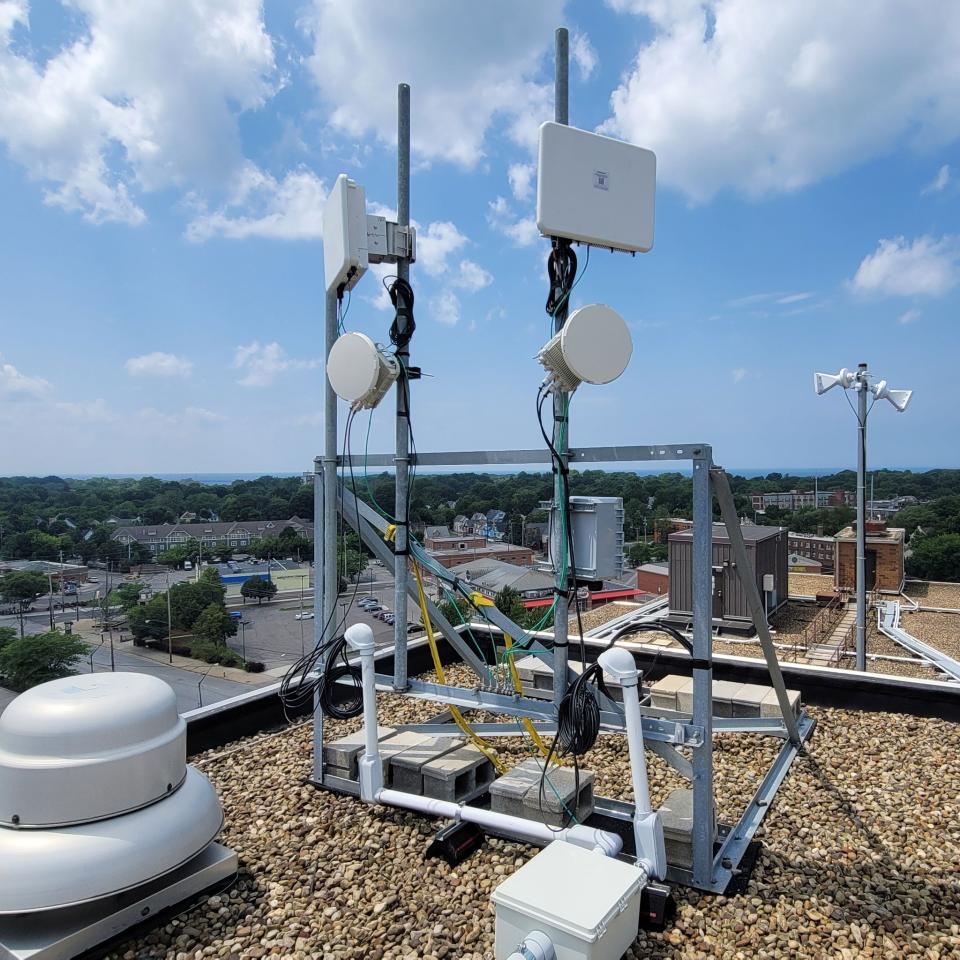 Fixed wireless antennas perched atop a building in Detroit