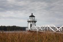 lighthouse and wooden pier in Arrowsic Maine